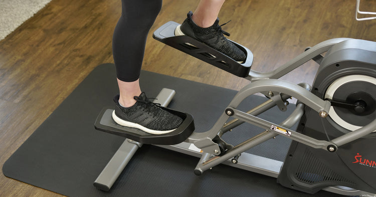 a person is working out on elliptical climber