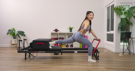 Sunny Trainer Shellie on the reformer Pilates machine.