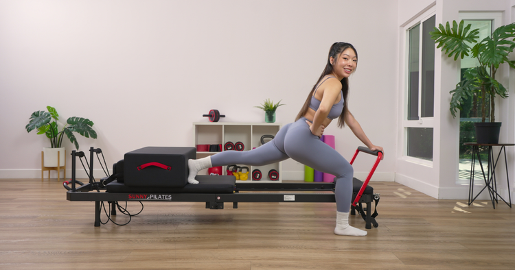 Sunny Trainer Shellie on the reformer Pilates machine.