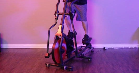 a man is working out with elliptical