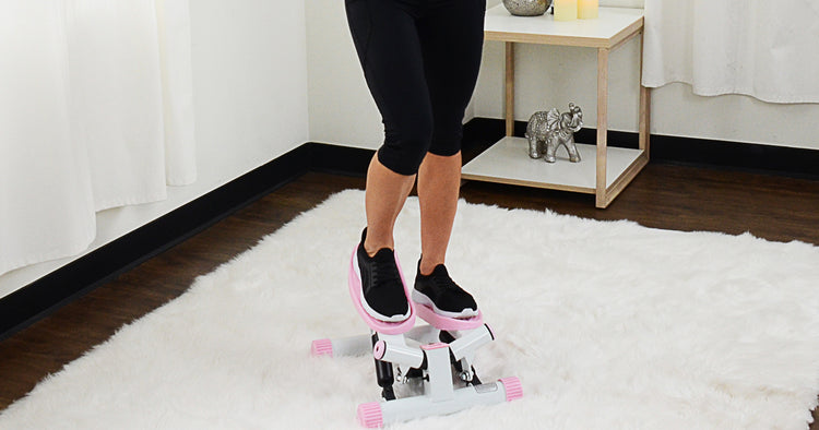 a woman is working out on sunny pink stepper