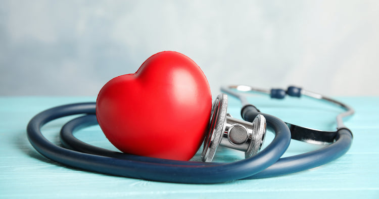 a red heart surround by a stethoscope