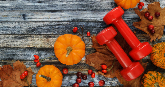 a pair of dumbbells with pumpkins