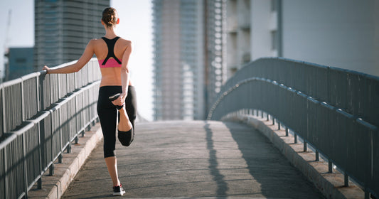 a lady is doing quad stretch