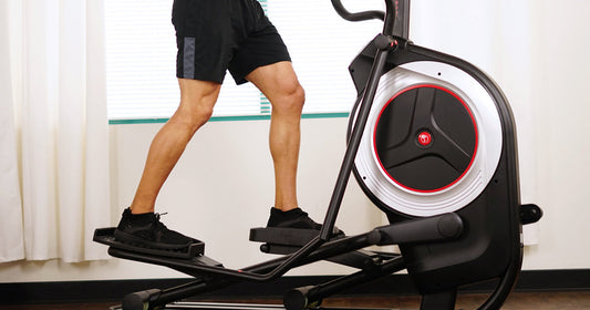 a man is using elliptical