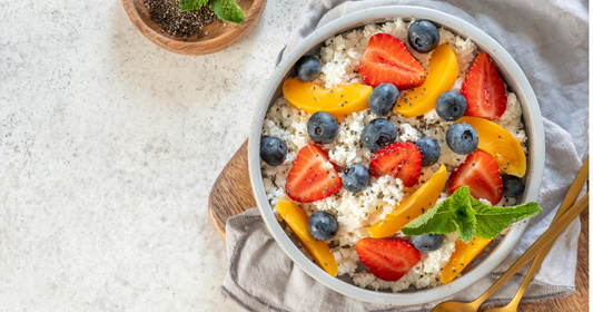 Cottage Cheese bowl with peach, strawberries, and blueberries