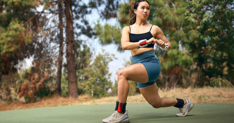 Woman doing lunges while wearing weighted wrist and ankle weights