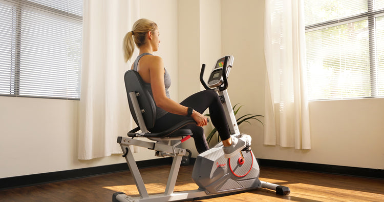 a person is pedaling a recumbent bike