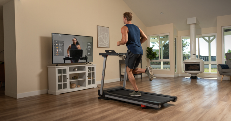 man runs on sunny fit treadmill