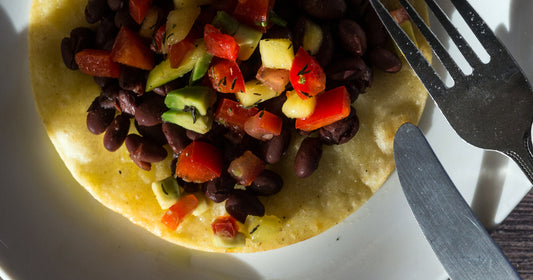 black bean tostada beside a fork