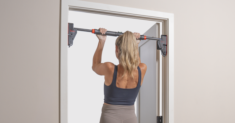 how to do a pull up woman performs a pull up