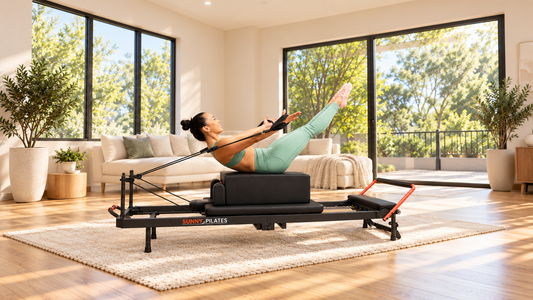 Woman using reformer pilates machine.