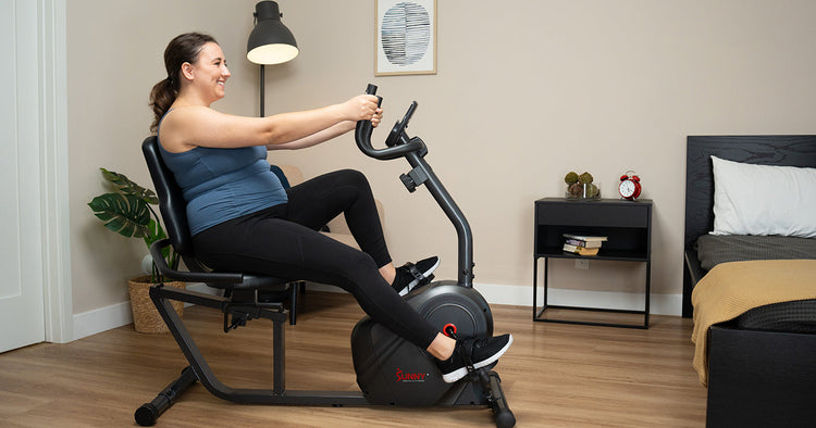Woman doing low-impact exercise on SF-RB4616SMART Smart Magnetic Resistance RecumbentRecumbent Bike
