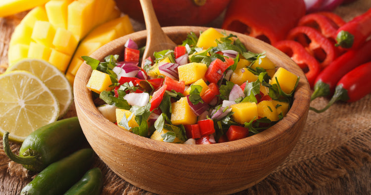 salsa with mango, pepper, jalapeno, cilantro and onions in a bowl