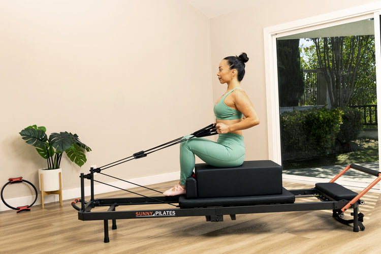 Reformer Pilates Explained: Benefits and Reformer vs. Mat Pilates