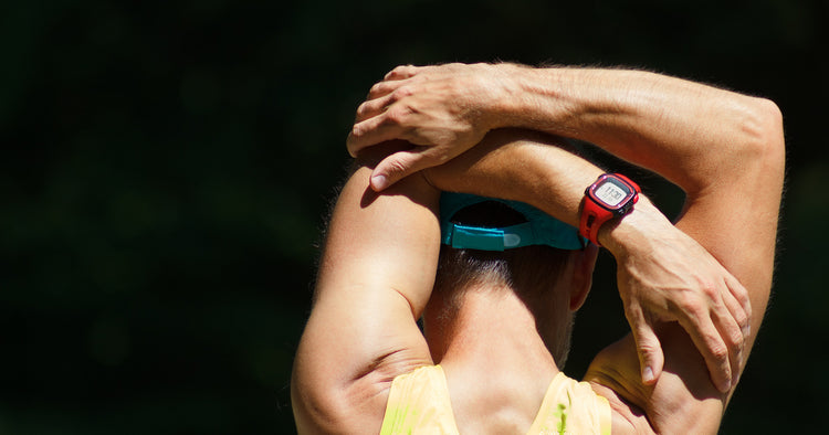 a man is stretching with black background