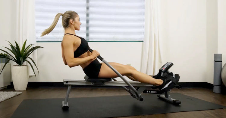 a woman exercising on rowing machine
