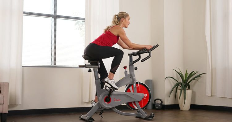 a woman is cycling in living room