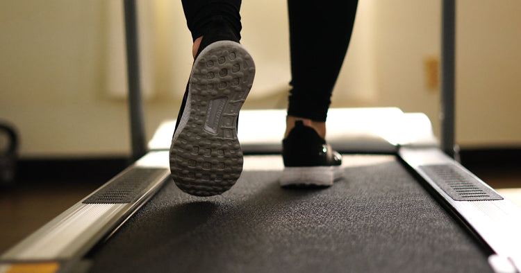 a man is walking on treadmill