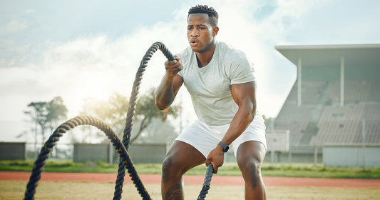 Man doing power training with ropes