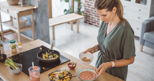 woman makes meal in her kitchen