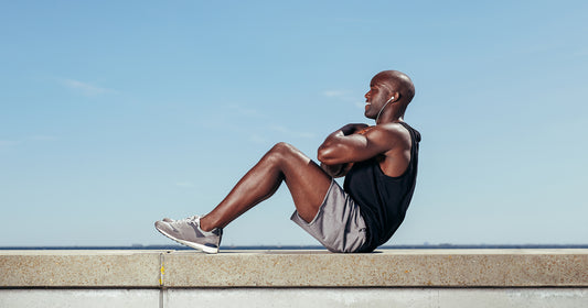 a man is sitting up outdoors