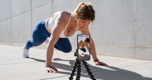 Woman filming TikTok workout