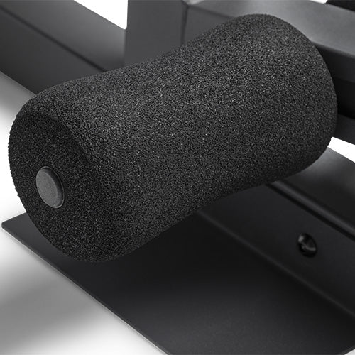 Adjustable Leg Lockdown | Thick foam rollers lock your ankles in place for safe, perfectly balanced sissy squats and sit-ups.