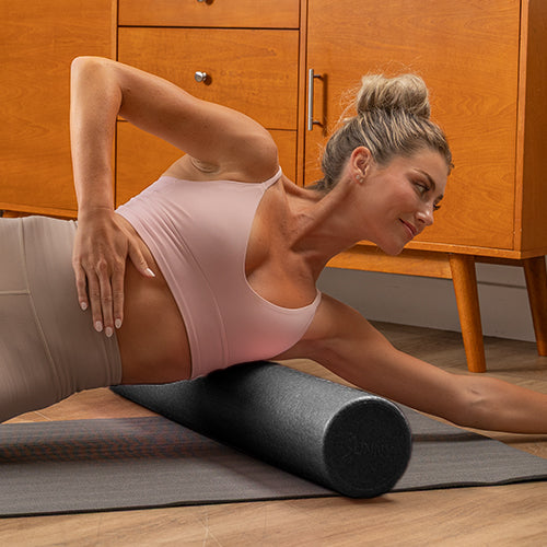 Lat Roll | Roll the foam roller along your side torso to release tight lats and shoulders.