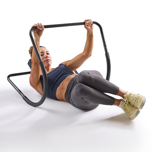 Side Crunches | A twisting motion is added to the crunch to target the obliques.