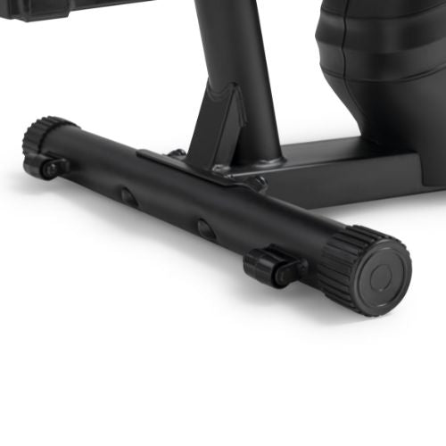 COMPACT, STABLE, AND HOME-READY | The heavy-duty steel frame supports up to 265 lbs while maintaining dependable stability during workouts. With a compact footprint, front transport wheels, non-slip stabilizers, and a built-in device holder, it is designed to fit more easily into apartments, bedrooms, offices, and home gyms.