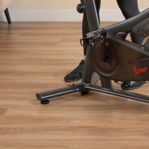 Non-Skid Adjustable Base | Micro-adjustable base stabilizers keep your bike steady on uneven floors for safe, wobble-free rides.