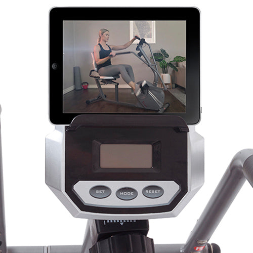 DEVICE HOLDER | Place your mobile device above the digital monitor and start your exercise routine watching your favorite Sunny Health & Fitness online training videos.