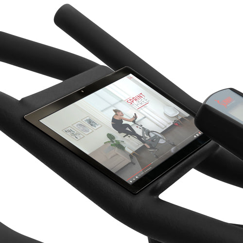DEVICE HOLDER | Say goodbye to flimsy tablet or phone holders on your bikes! The device holder is incorporated directly into the rubberized non-slip handlebars which enhances grip and feel, keeping your tablet, phone, or laptop secure.