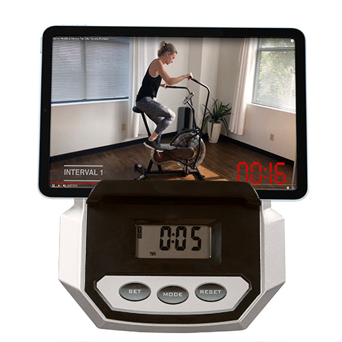 DEVICE HOLDER  | Prop up your smart device on the holder to watch movies, workout videos or play your favorite music while you ride.