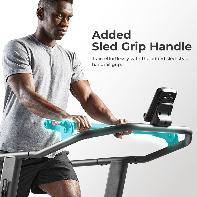 man holding handle on manual curve treadmill with text "Added Sled Grip Handle"