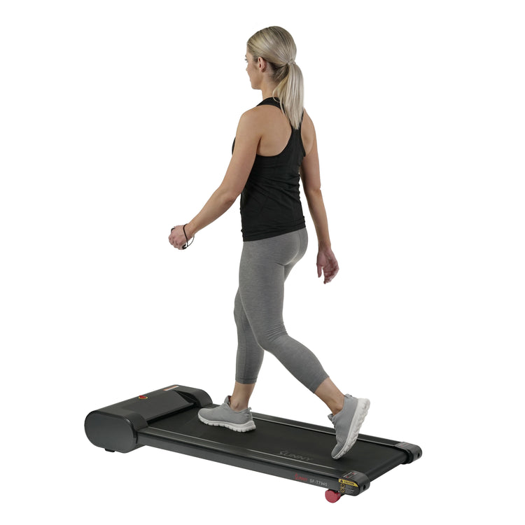 https://sunnyhealthfitness.com/cdn/shop/products/sunny-health-fitness-treadmill-walkstation-slim-flat-treadmill-for-under-desk-and-home-SF-T7945-lifestyle5_750x.jpg?v=1668122978